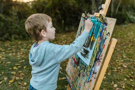 child painting a colorful landscape