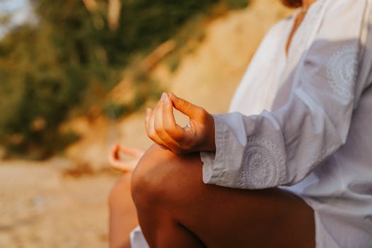 person meditating outdoors