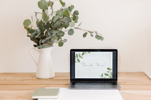 a serene workspace with a notebook and plants