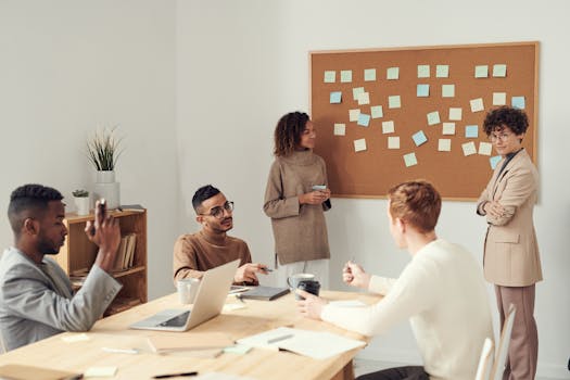 a group of people working on vision boards