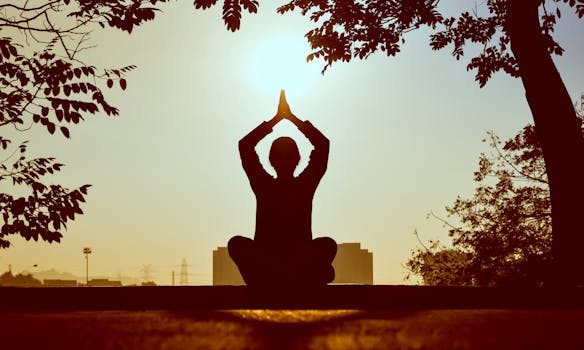 person meditating in nature