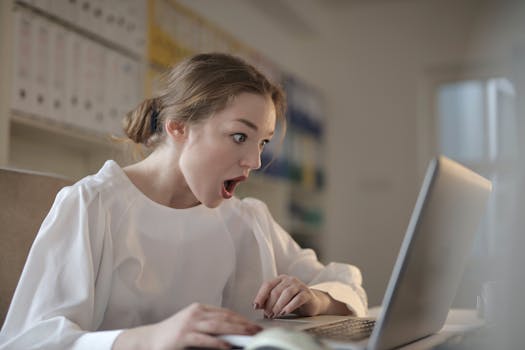 person looking stressed at a computer