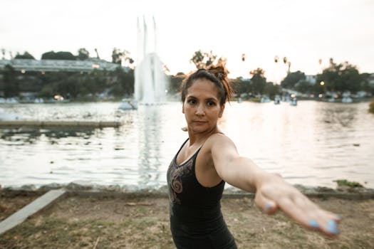 person doing yoga in a park